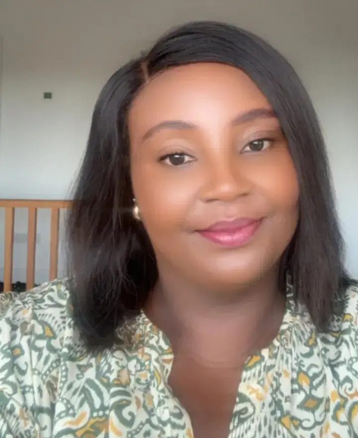 Smiling woman wearing patterned blouse